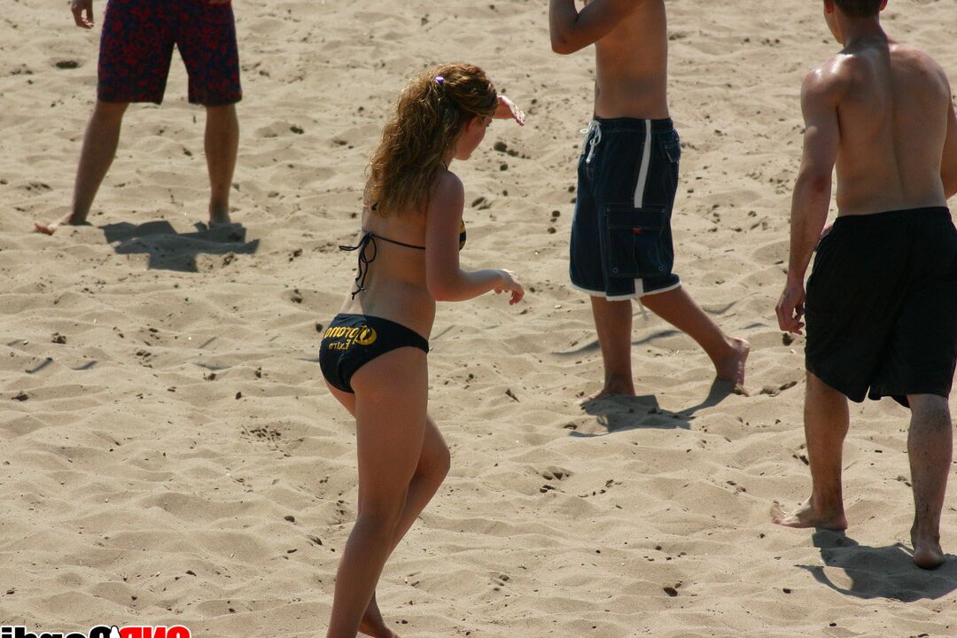 12P Girl with huge tits in a bikini at the beach