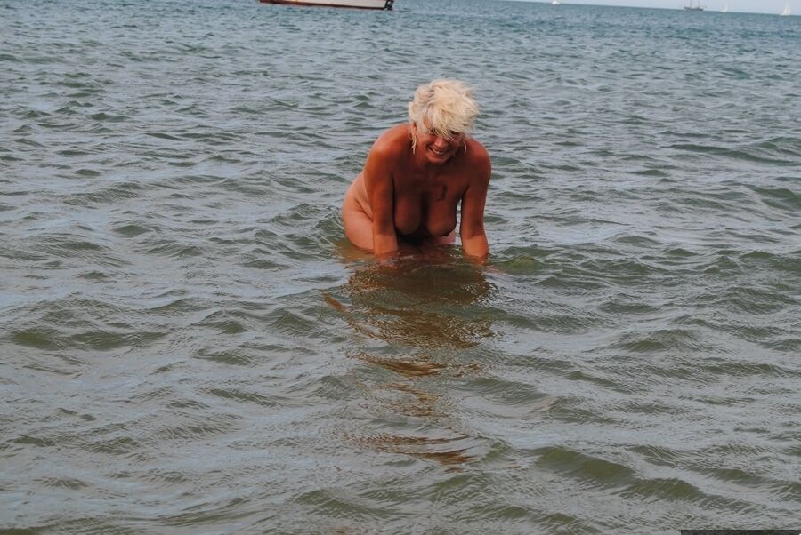 20P Older platinum blonde Dimonty takes a dip in the ocean while totally naked
