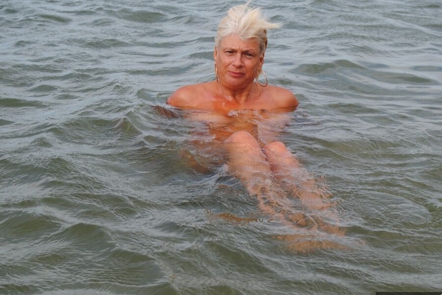 20P Older platinum blonde Dimonty takes a dip in the ocean while totally naked