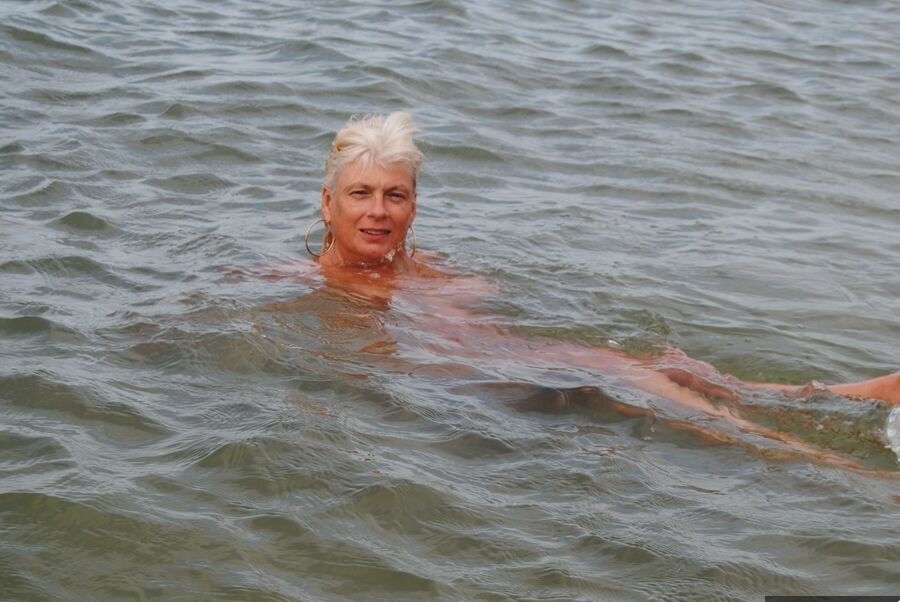 20P Older platinum blonde Dimonty takes a dip in the ocean while totally naked