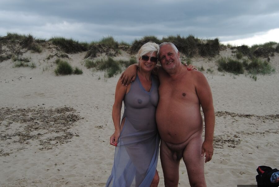 19P Mature blonde Dimonty eats an ice cream treat after nude modeling at the beach