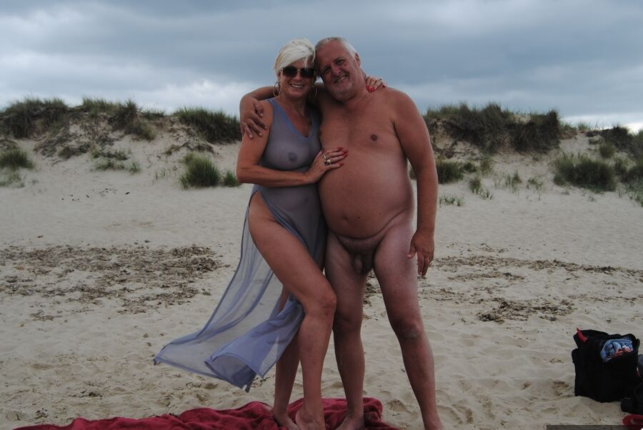19P Mature blonde Dimonty eats an ice cream treat after nude modeling at the beach