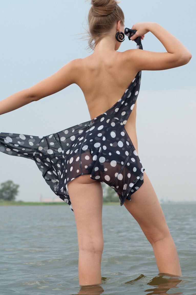 21P Hot teen model Bridgit A stripping and posing nude in the water