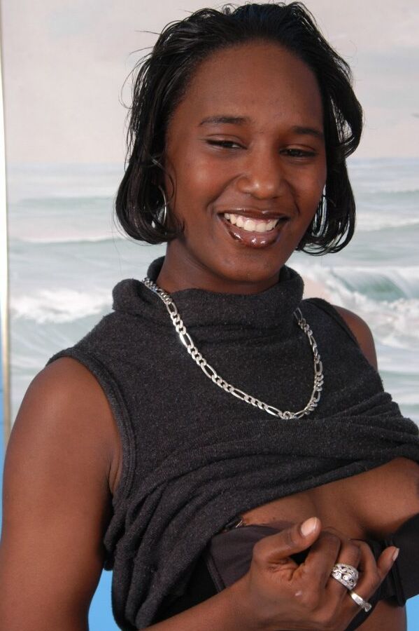 20P Ebony chick plays with her vagina after a slow striptease is complete