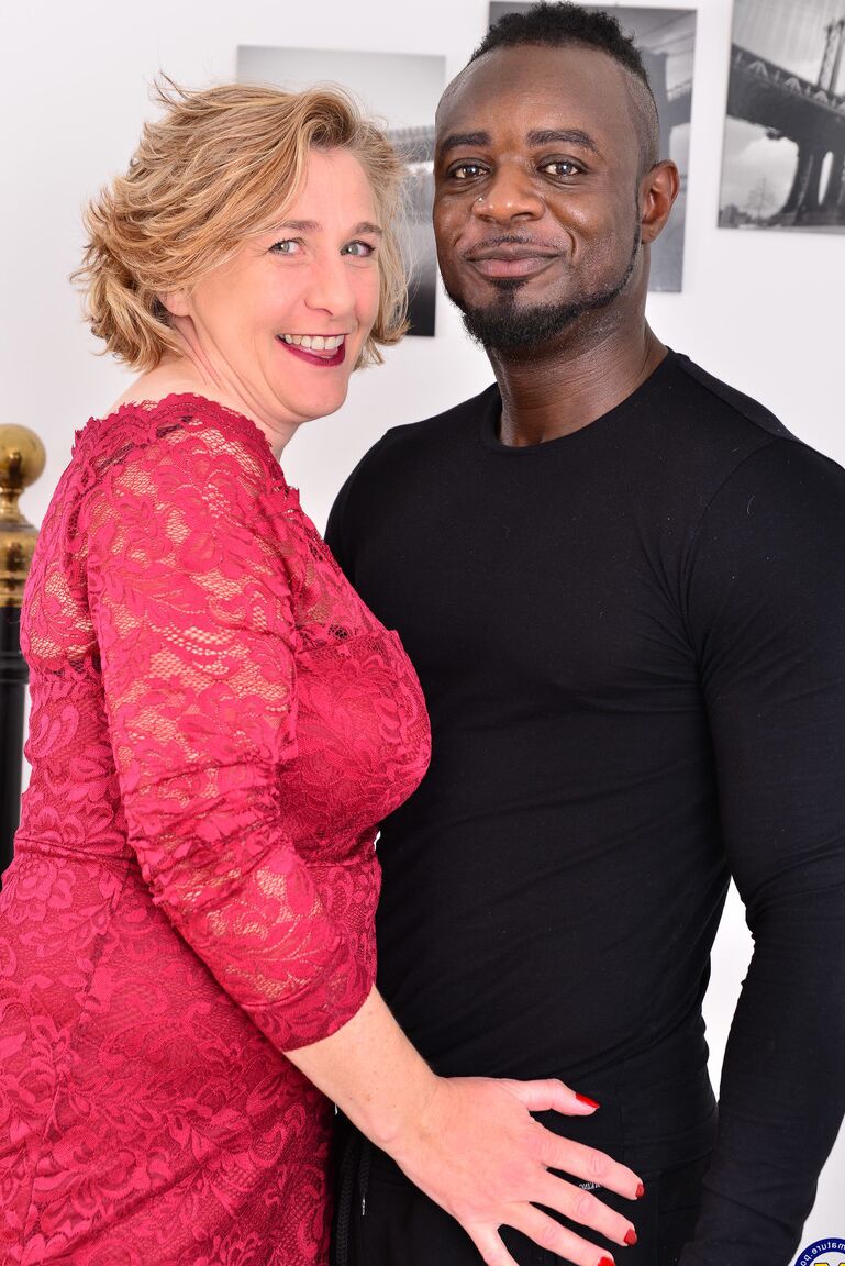 21P Busty mature nympho Camilla C strips and fucks a handsome black dude