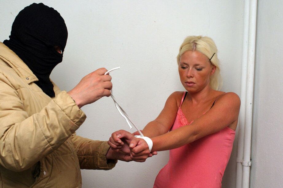 12P Clothed blonde is shut up with duct over mouth and wrists tied together