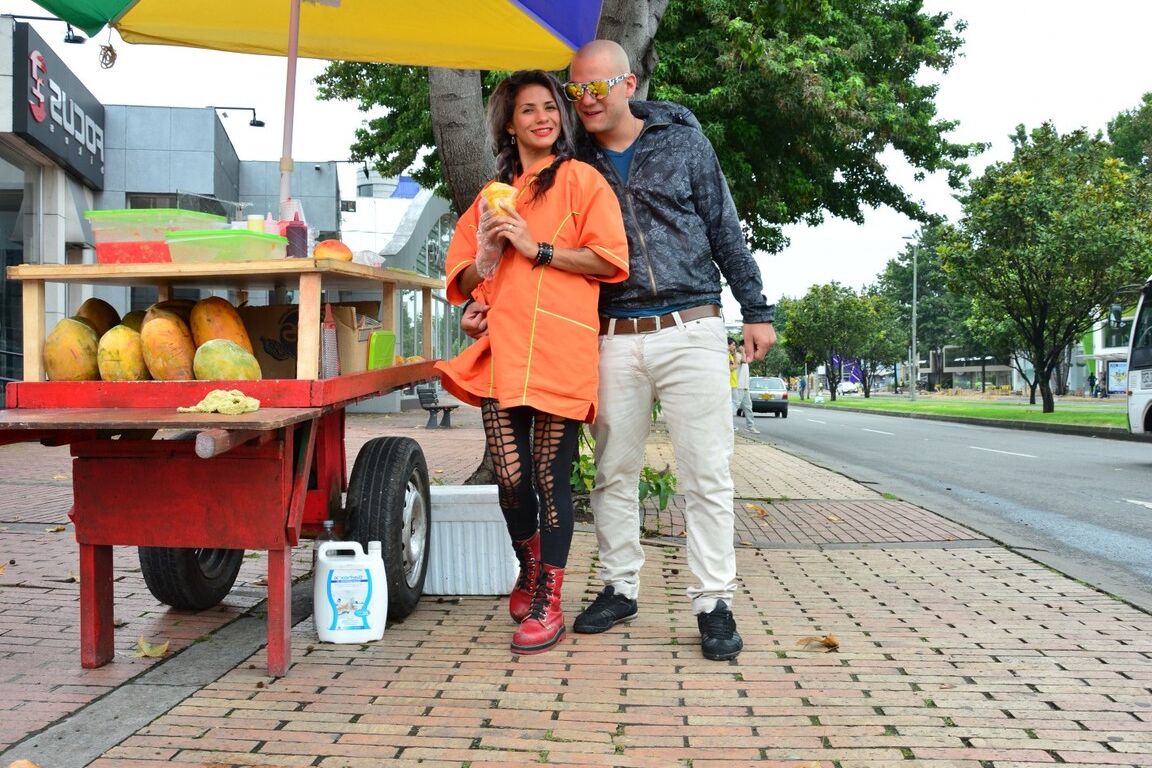 17P Beautiful Colombian fruit seller gestures provocatively with a banana