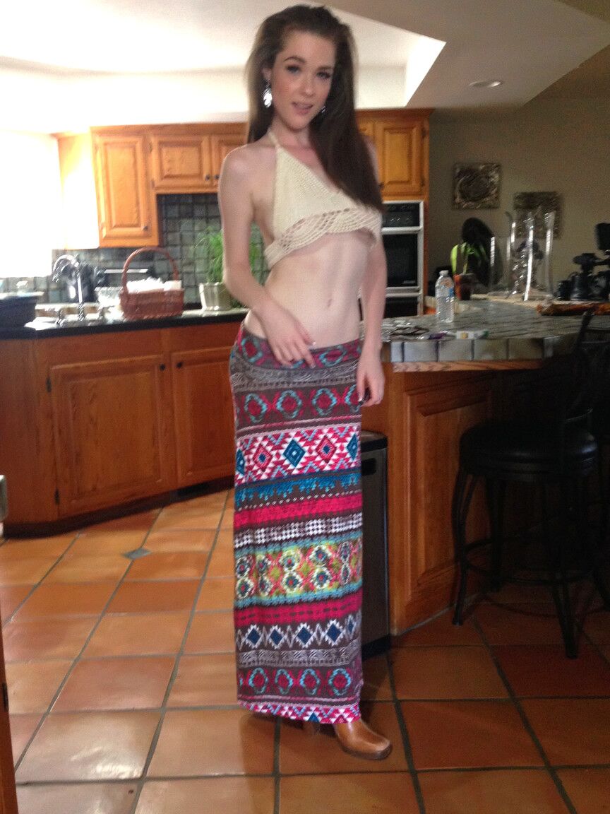17P Redhead hippie babe Penny Brooks strips her clothes to bare tiny tits