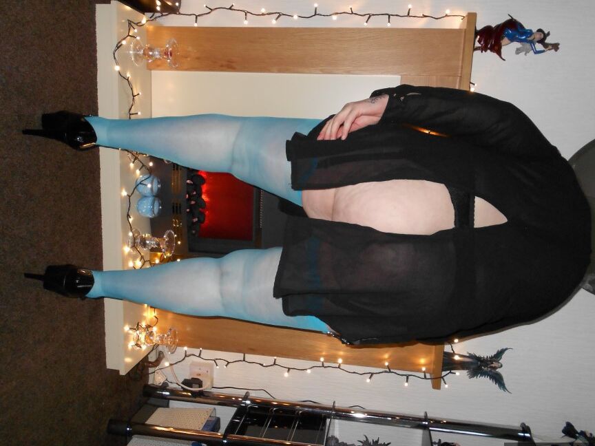 20P Older redhead Valgasmic Exposed exposes herself while in garters & blue nylons