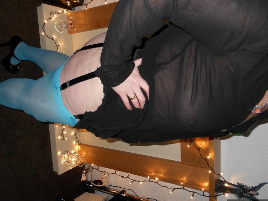 20P Older redhead Valgasmic Exposed exposes herself while in garters & blue nylons