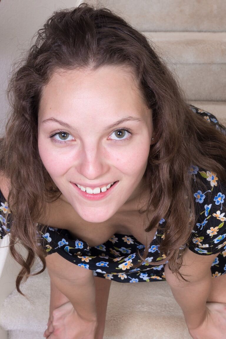 21P Brunette with small breasts Penelope Jones exposing her hairy twat