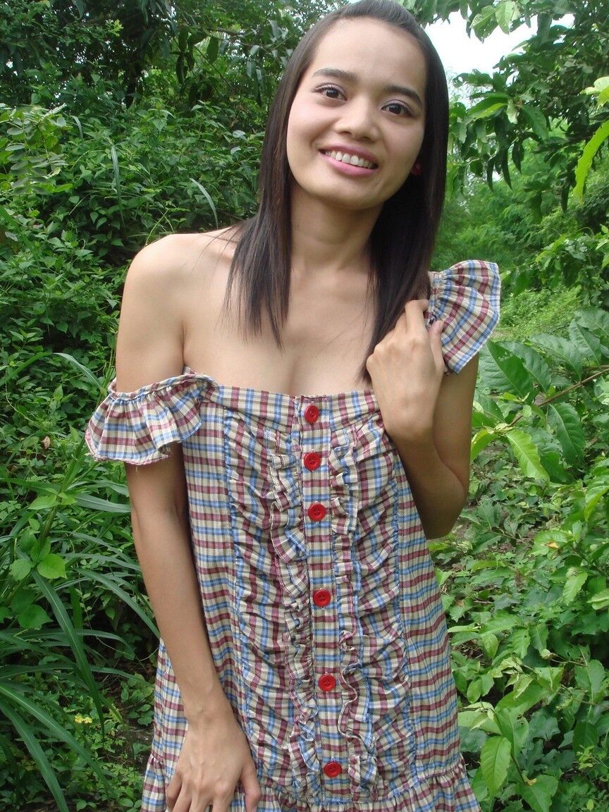 16P Young Asian girl gets in a vehicle after baring her tits and twat amid bushes