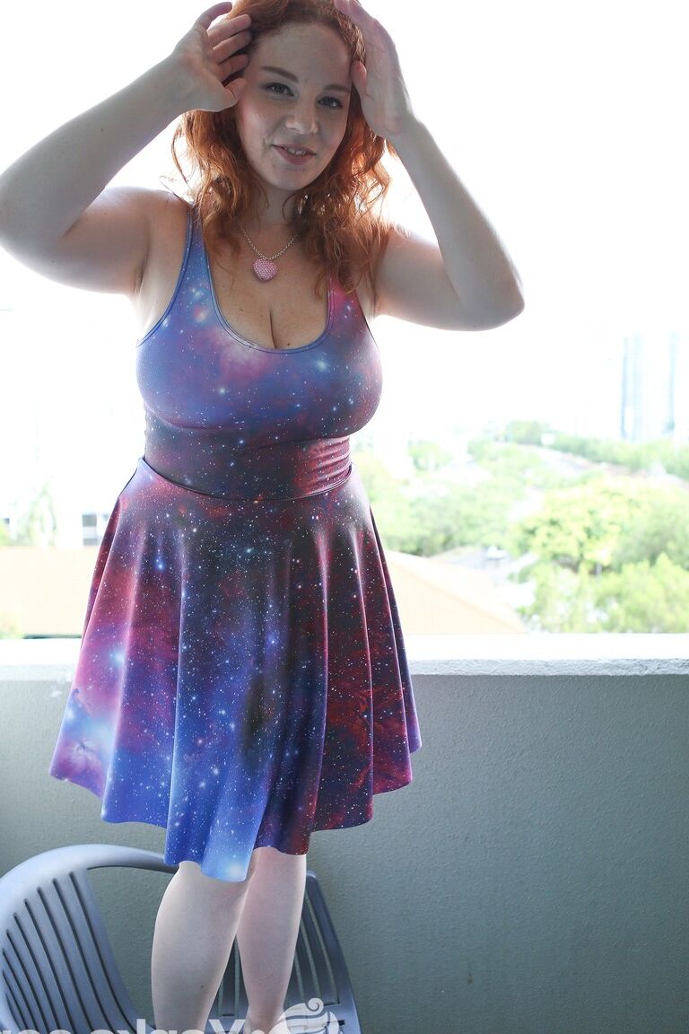 16P Chubby solo girl with curly red hair unleashes her incredible breasts