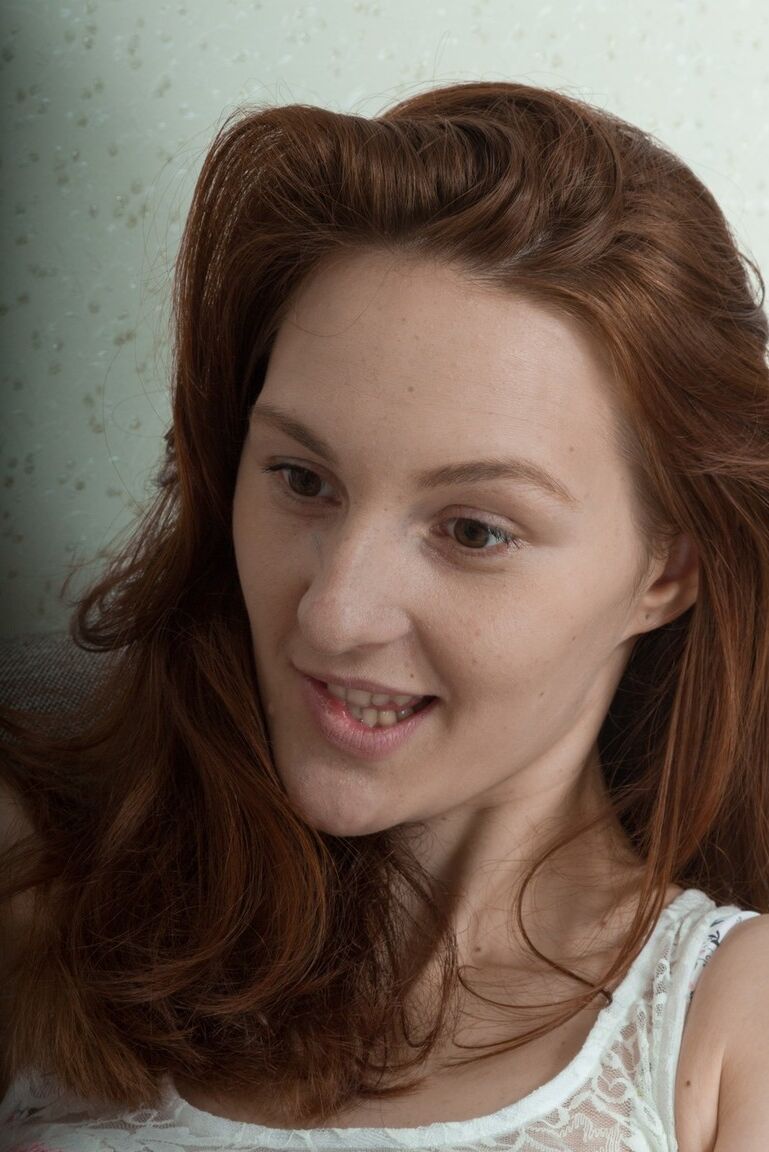 16P Pale redhead Ariadna Moon removes her floral underthings to expose her beaver