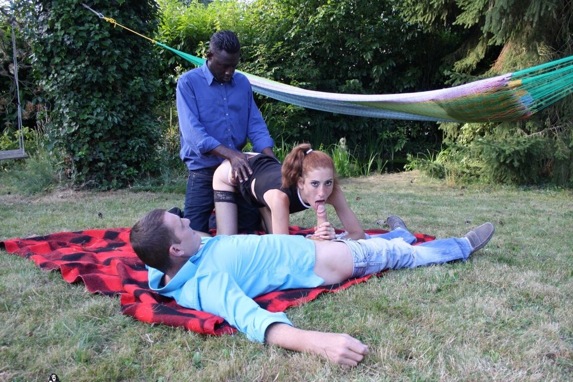 19P Skinny redhead gets hot double penetration in interracial outdoor threesome