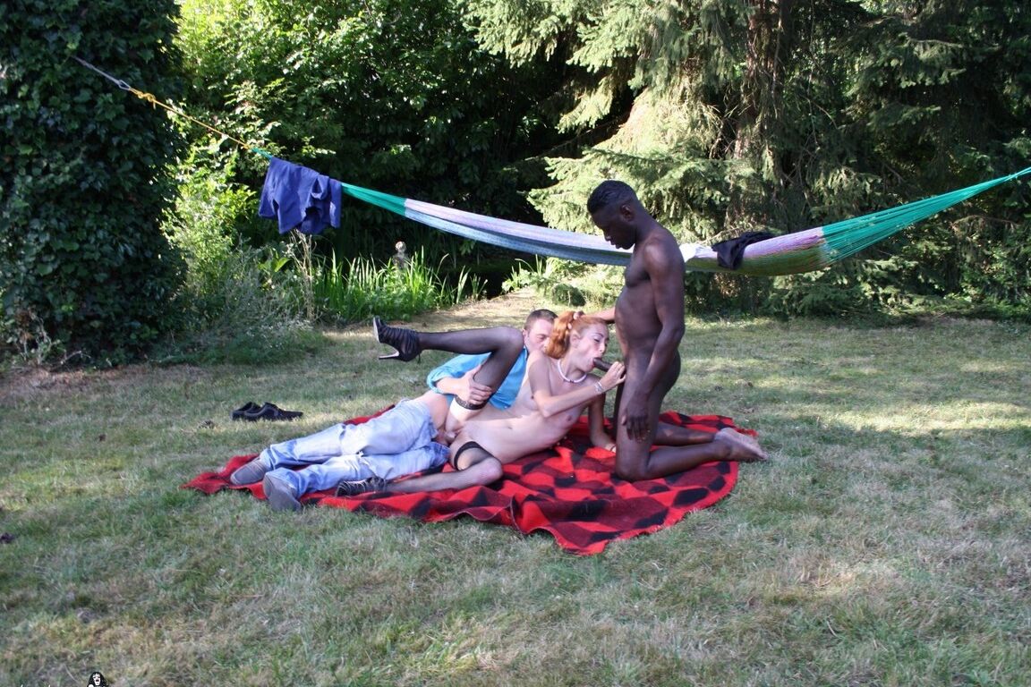 19P Skinny redhead gets hot double penetration in interracial outdoor threesome