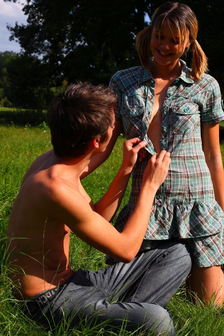 15P The soft green grass is the bed for these horny teens today They use it like a