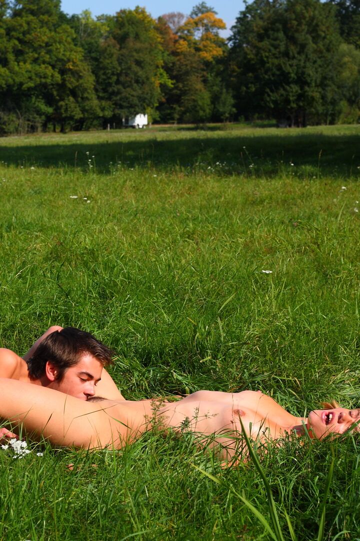 15P The soft green grass is the bed for these horny teens today They use it like a