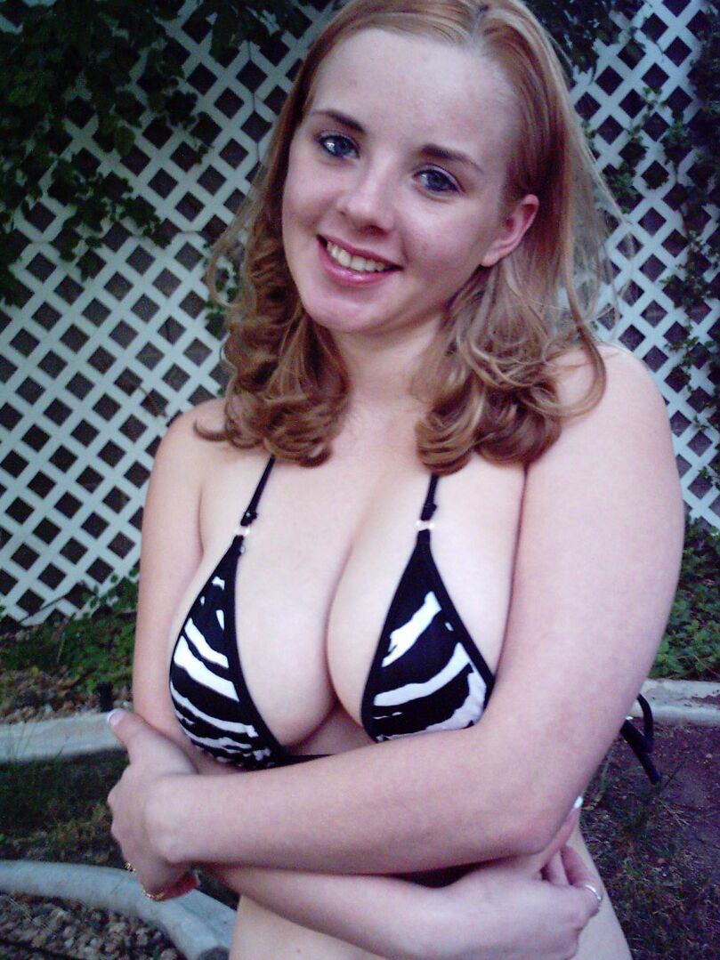 12P Busty red head teases with her huge teen tits in a tiny bikini top