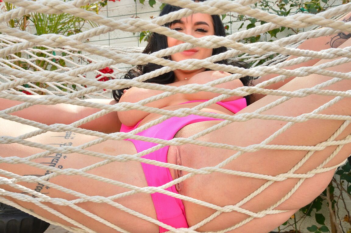 15P Dark-haired amateur changes her clothes before getting naked on a hammock