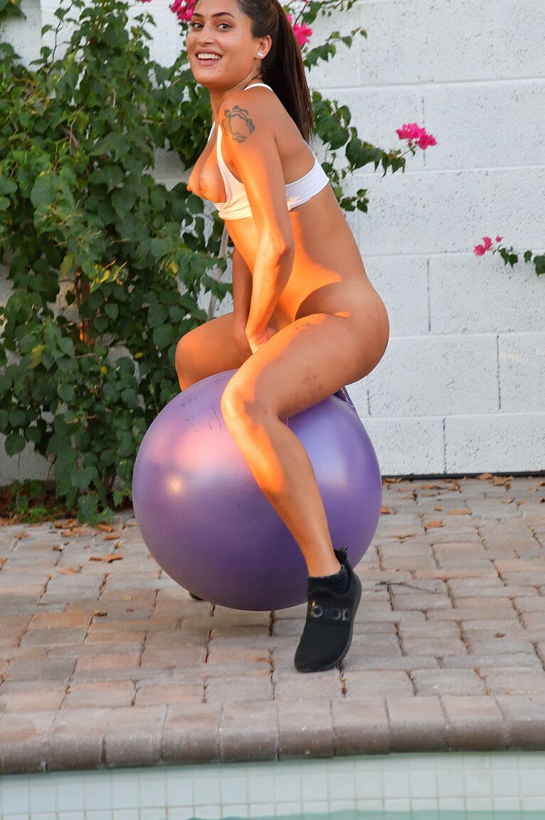 15P Fit amateur Sommer rides a bouncy dildo ball after exercising on a patio