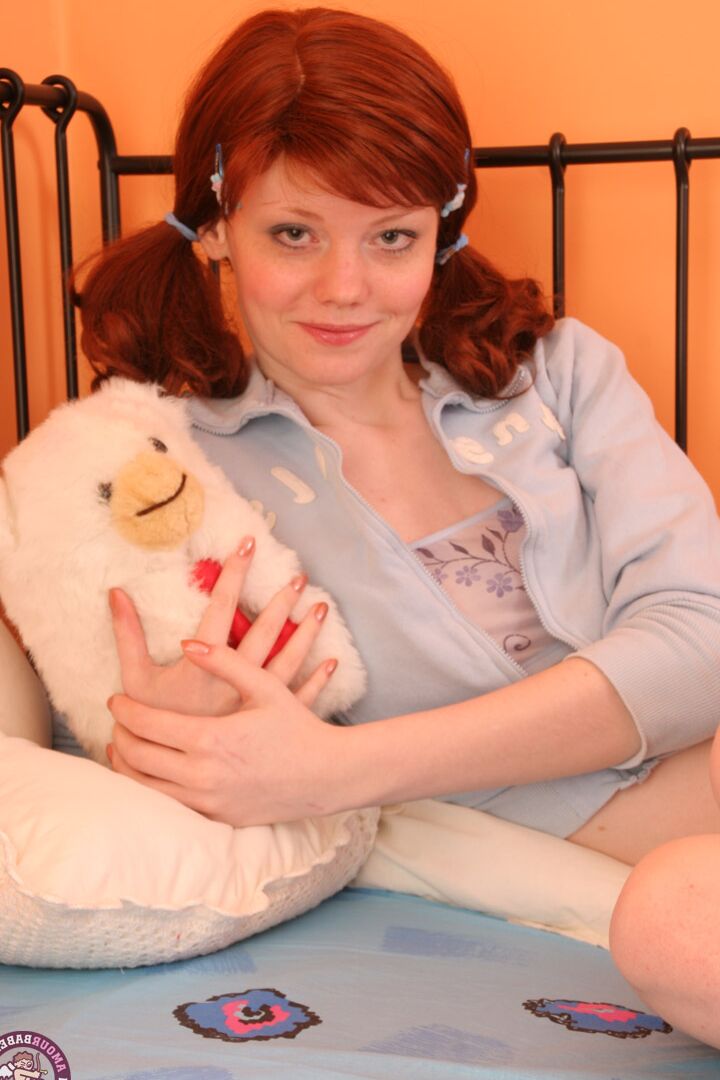 21P Redheaded virgin Muza masturbates with a pink vibrator with her legs wide open