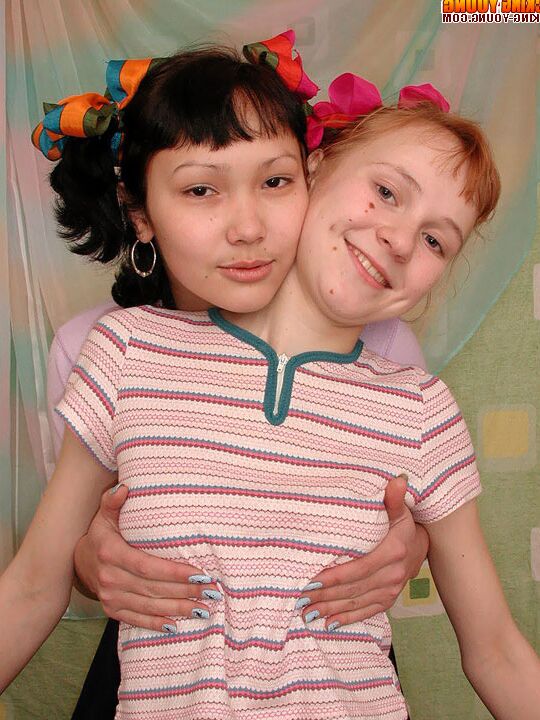 20P Barely legal dykes share a double ended dildo on their shared bed