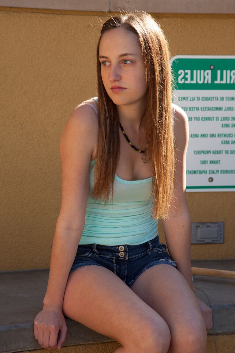 11P Amateur babe Giselle Locke poses in her shorts before stripping to her panties