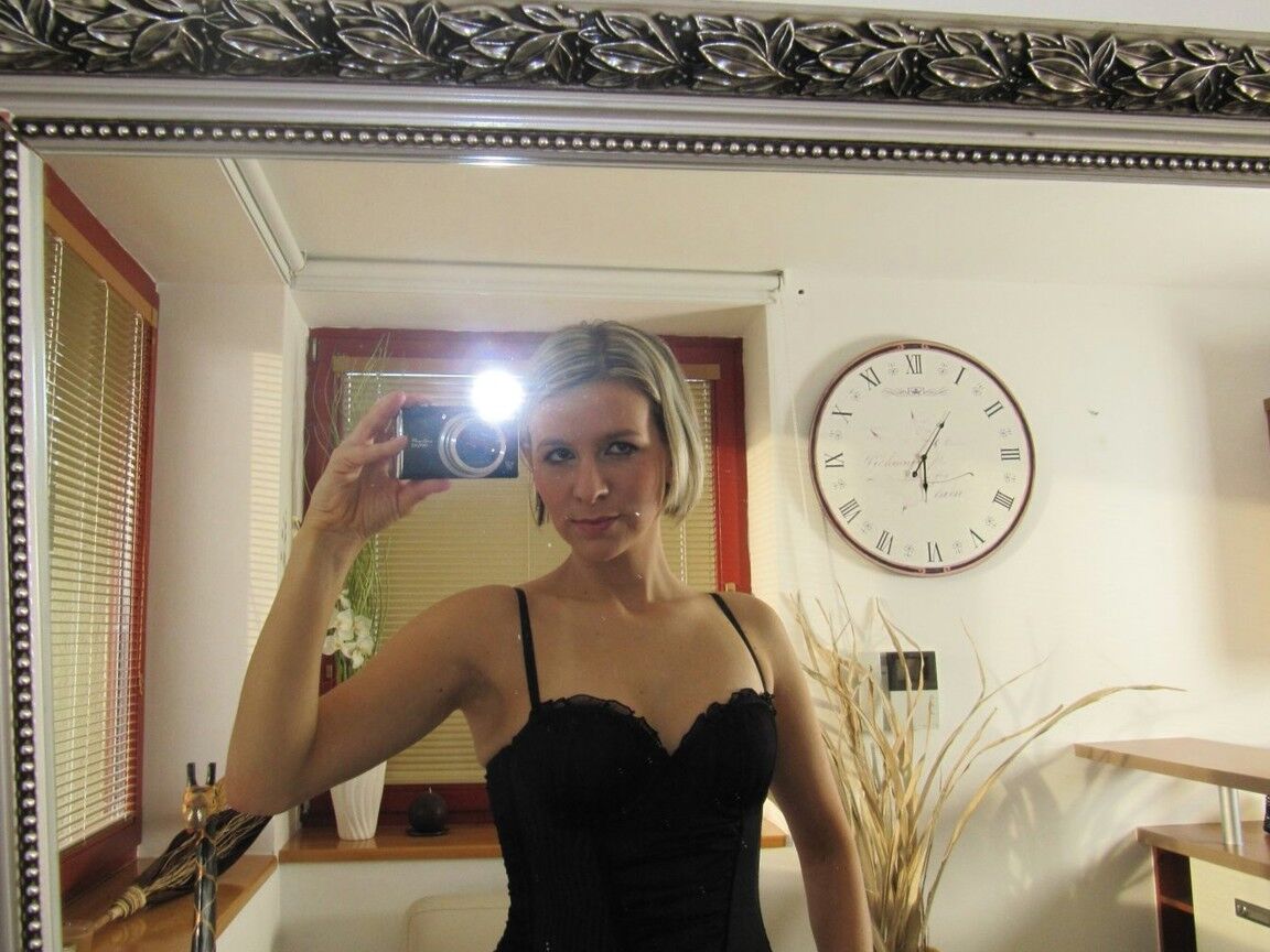 15P Blonde amateur takes self shots while getting totally naked afore a mirror