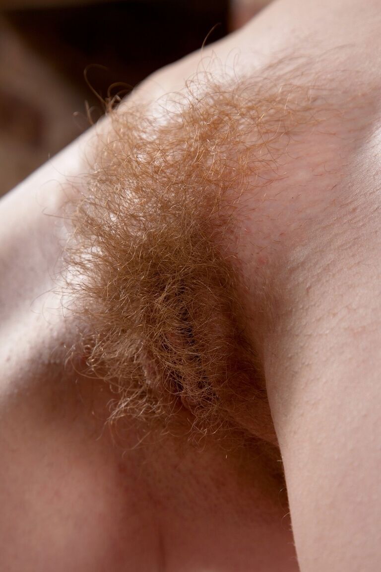 21P Small boobed model Cate strips in front of the fireplace & flaunts her bush