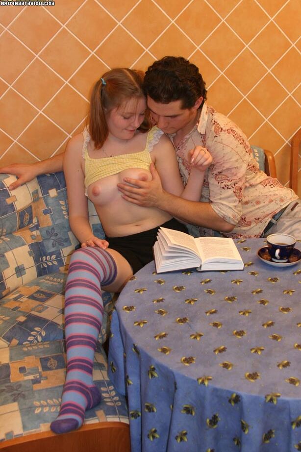 20P Young looking redhead takes it up the ass in long socks and pigtails