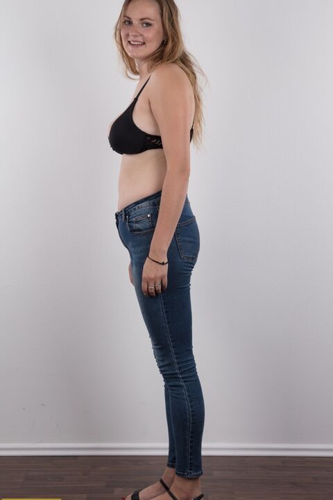 20P Chubby teen stands fully clothed before doing the same without any clothes on