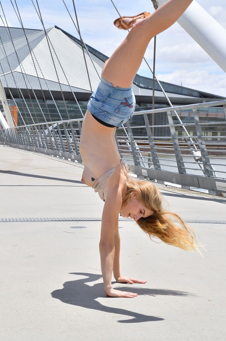 15P First timer Angelina does a handstand after exposing her natural tits outdoors