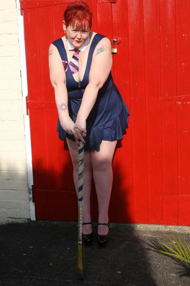 20P Mature redheaded wields a field hockey stick while exposing herself outdoors