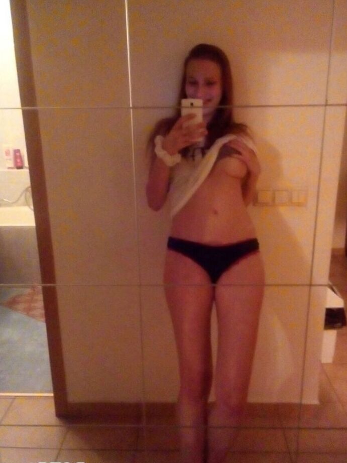 12P Young redhead Radka takes clothed and topless selfies around her place