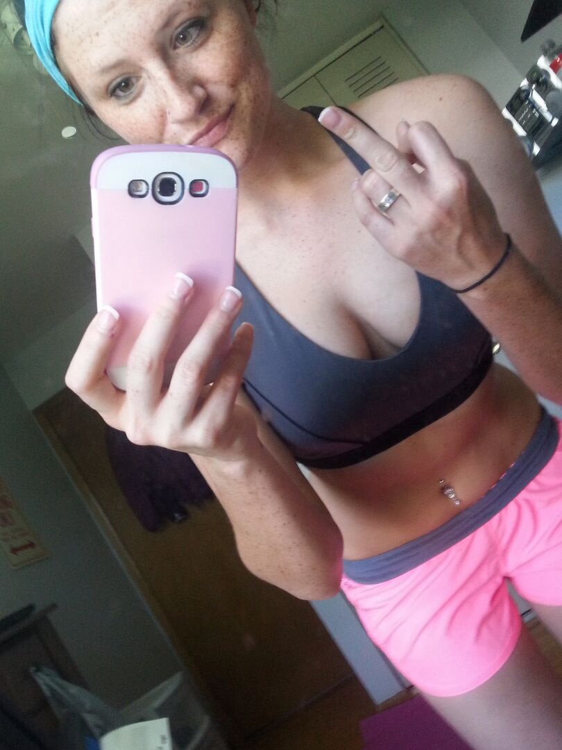 12P Pierced amateur Freckles takes self shot posing in shorts & sexy panties