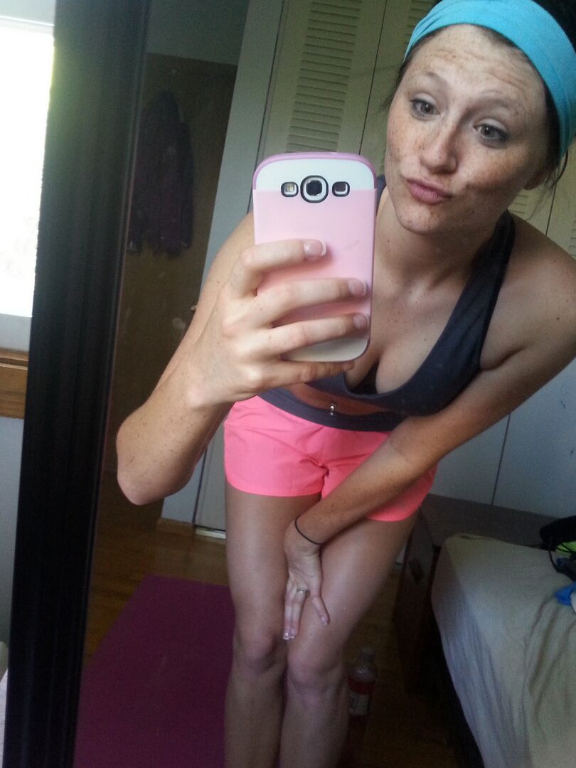 12P Pierced amateur Freckles takes self shot posing in shorts & sexy panties