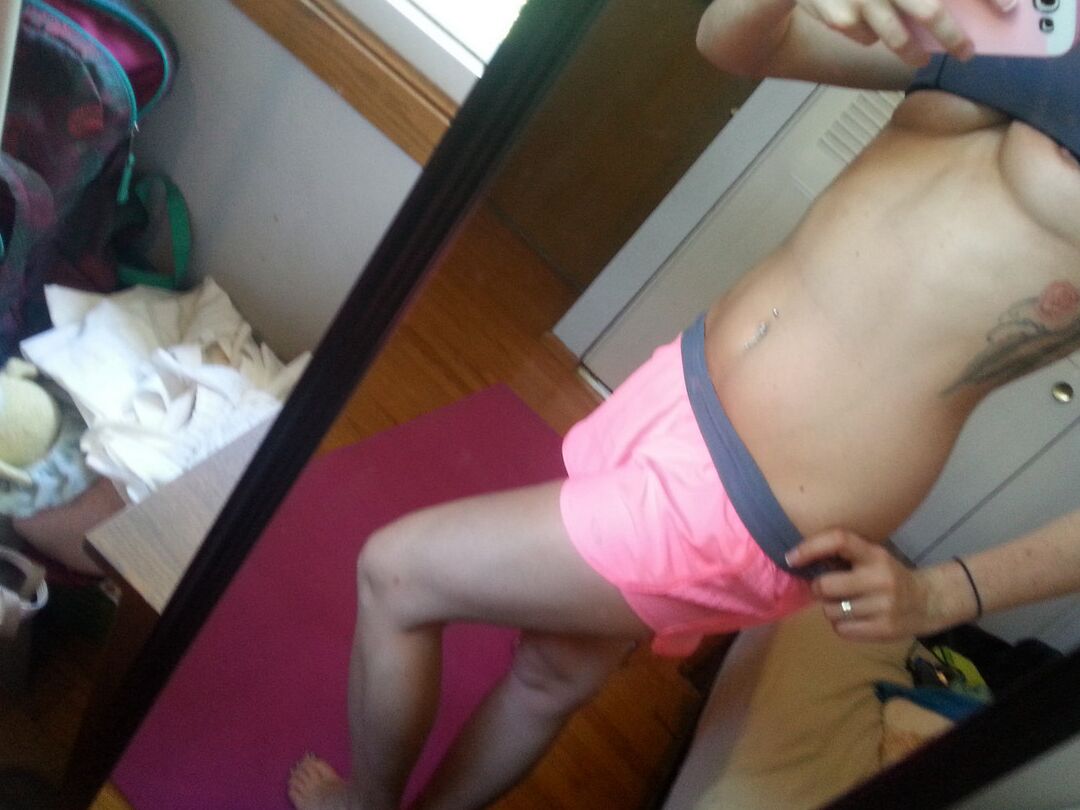 12P Pierced amateur Freckles takes self shot posing in shorts & sexy panties
