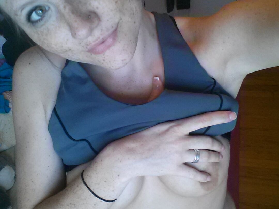 12P Pierced amateur Freckles takes self shot posing in shorts & sexy panties