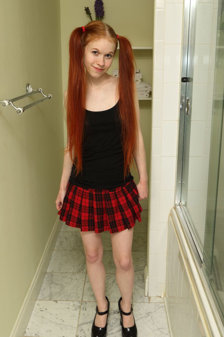 20P Petite teen Dolly Little squats down and takes a leak in the hallway
