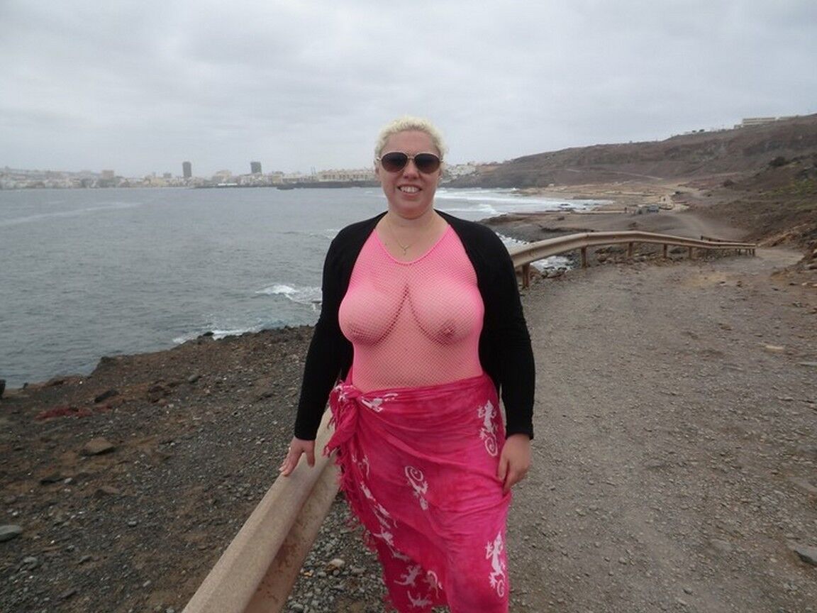 16P Aged lady Barby looses her big tits from a crotchless bodystocking by the sea