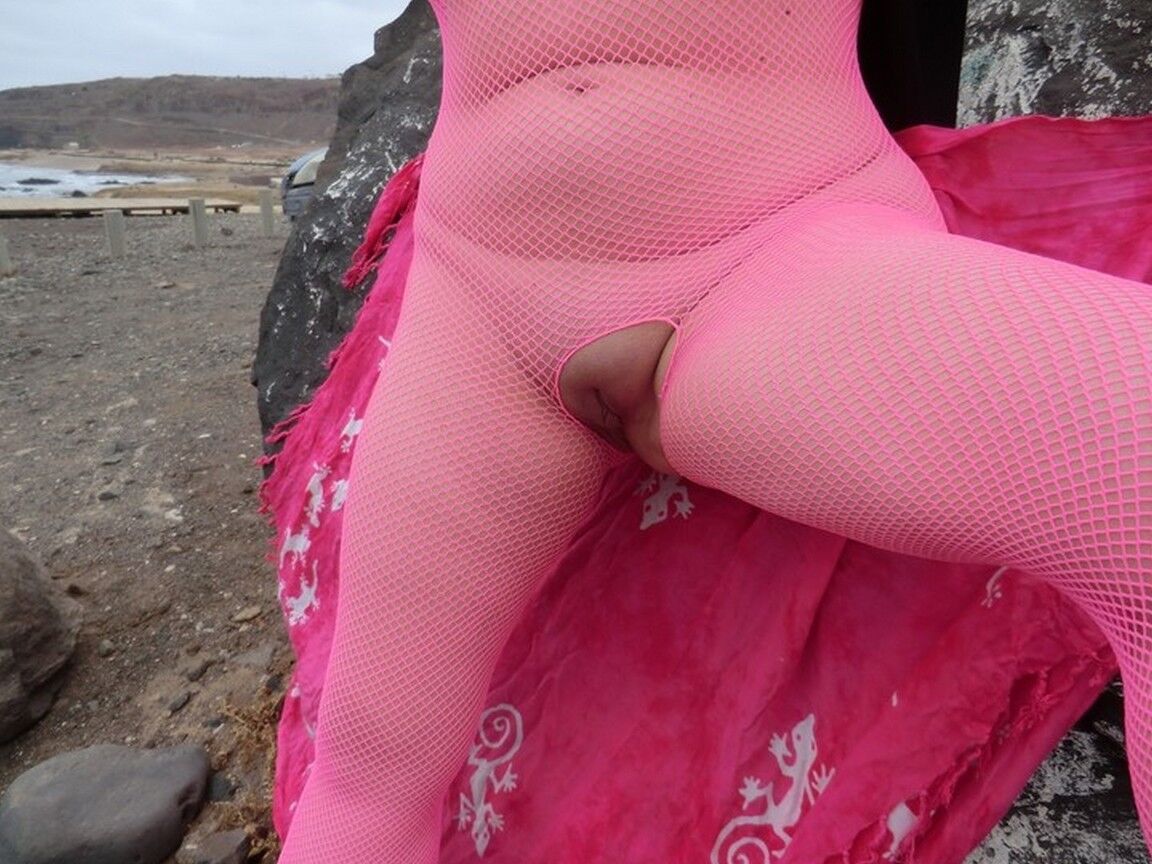 16P Aged lady Barby looses her big tits from a crotchless bodystocking by the sea