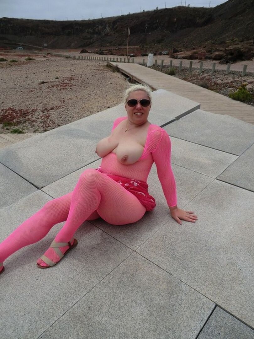 16P Aged lady Barby looses her big tits from a crotchless bodystocking by the sea