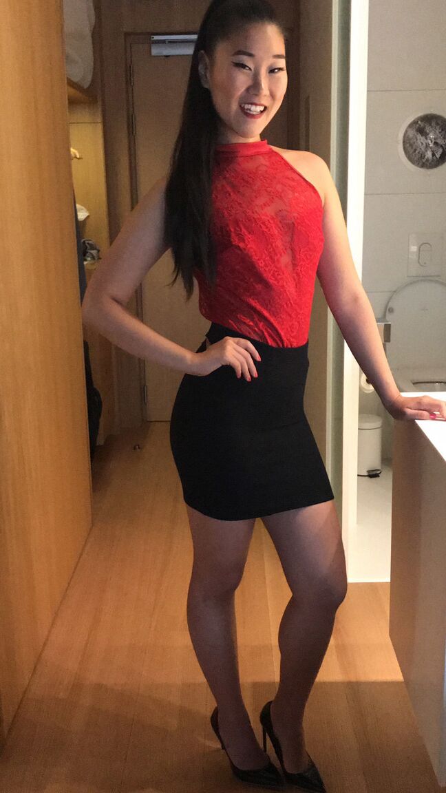 15P Asian chick in a black miniskirt gets undressed before POV sex on a bed