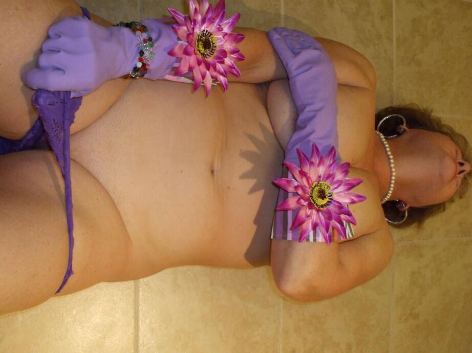 20P Older lady Busty Bliss goes topless in latex gloves before playing with a cock