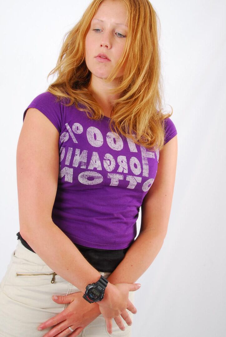 16P Natural redhead Judy models a black G-Shock watch while fully clothed