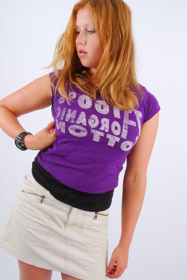 16P Natural redhead Judy models a black G-Shock watch while fully clothed