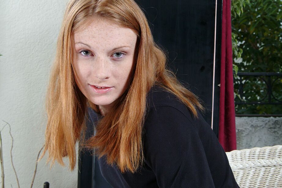 16P Clothed redhead Allison is demonstrating her shaved pussy