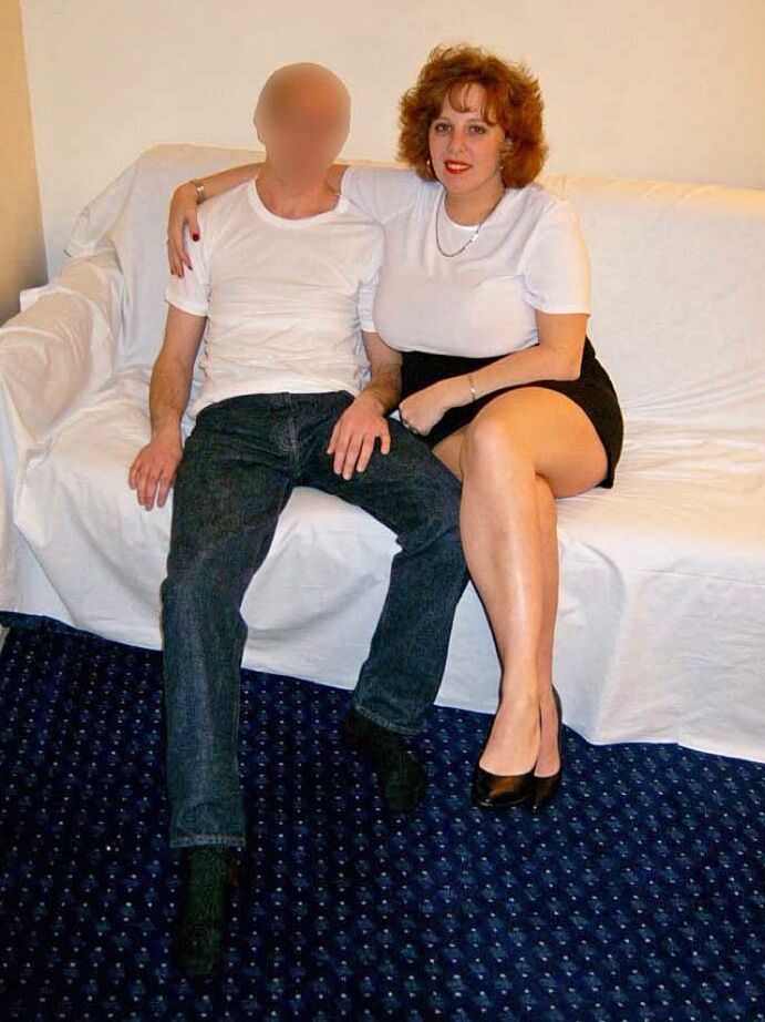 20P Thick older redhead Curvy Claire tit smothers a man with her large breasts
