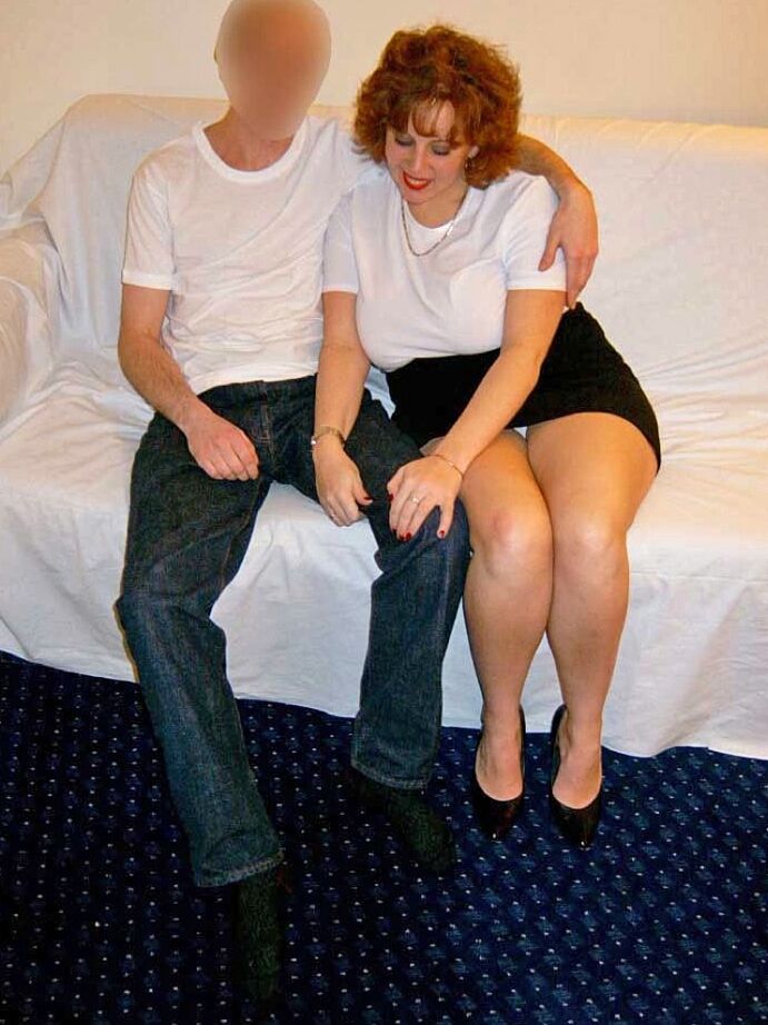 20P Thick older redhead Curvy Claire tit smothers a man with her large breasts